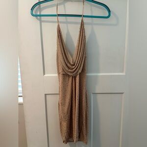 Gold mini dress with adjustable neck strap and cowl neck made for a night out!
